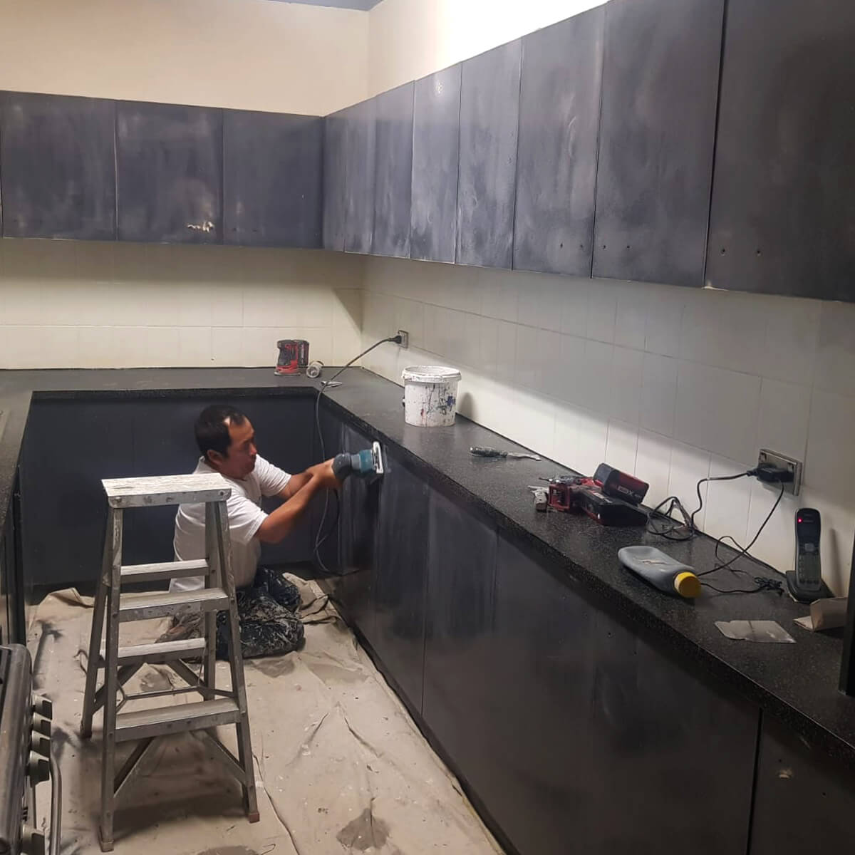 PaintPerfectionist Worker Painting the Interior of a House